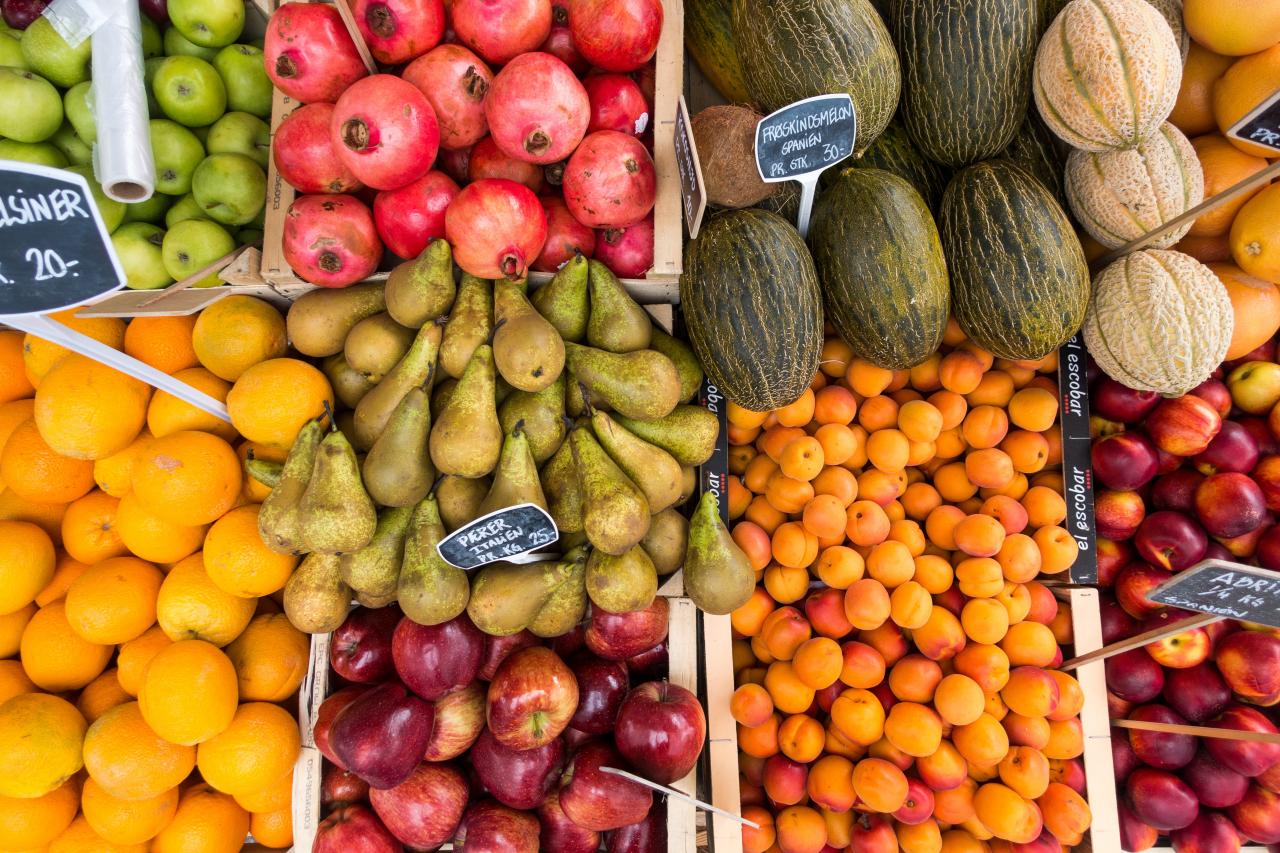 Overhead photograph of various fruit at a market.